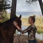 Image of Mary Rondepierre outside with a horse